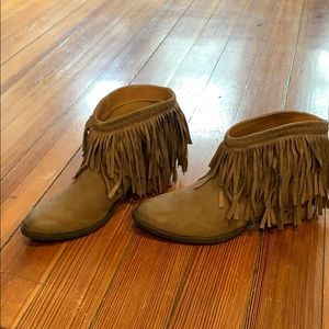 Tan suede ankle fringe booties.